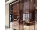 Sleek Glass Partition Solutions with Sliding Doors for Any Room